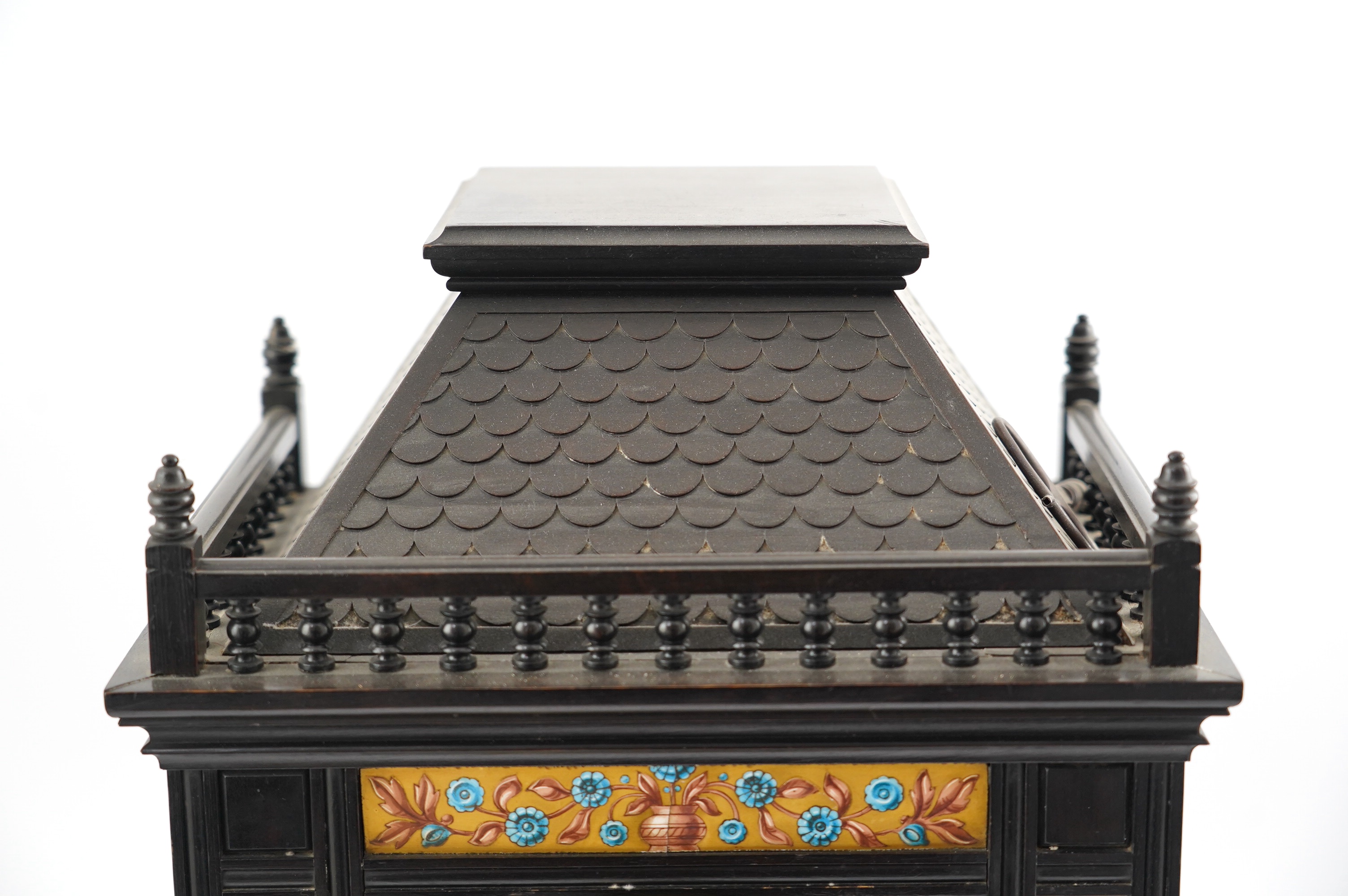 A Victorian Aesthetic Movement ebonised architectural mantel clock, probably designed by Lewis Foreman Day